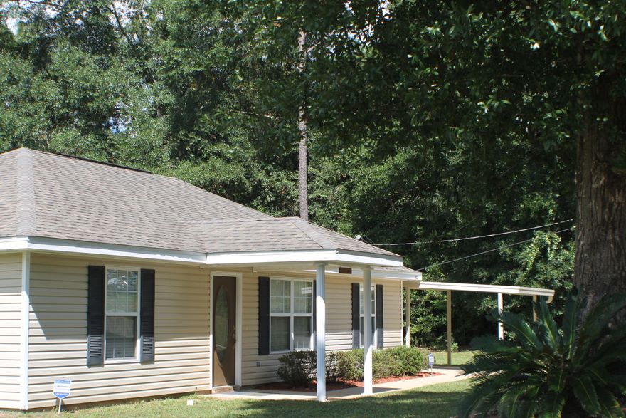 Beautiful three bedroom two bath on a corner lot! This home has laminate wood and tile floors. The back yard is fenced with a covered patio and a pool deck! The above ground pool is ready to enjoy! The open floor plan is inviting and a great place to entertain or have a family get together! This location is close to town and ready for your family!