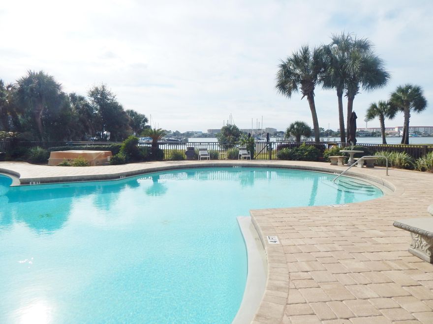 LOOK AND ''LOVE THIS STUDIO CONDO''. A Beautifully UPDATED throughout, WATERFRONT Studio Unit, ALSO NEWLY AND FULLY FURNISHED., VIEW THE MANY PICTURES.. And YES, IT HAS A 36FT BOAT SLIP #E13 (LARGER SLIPS AVAILABLE IF NEEDED, FOR AN ADDITIONAL AMOUNT DETERMINED BY SIZE... Boat Lifts can be installed with Complex approval.. UPDATED THROUGHOUT AS MENTIONED, INCLUDING A FULL KITCHEN, loads of Cabinets, with FULL SIZED Range/Oven, Microwave, Refrigerator w/Ice Maker... and even TWO 55 inch wall swivel/tilt mounted TV's. LOADS of LIGHTING every direction, will keep you feeling vibrant. Granite Counter Tops,Floor Tile throughout. SO MUCH INCLUDED THAT IT IS A DEFINITE MUST SEE FOR YOU. THE COMPLEX HAS MUCH TO OFFER. ''Click MORE'