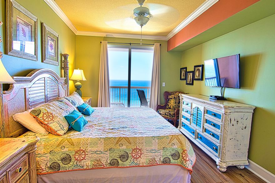 Sunrise 1802 Seller has reduced the price and is now including its own rental website, VisitPCB.com, future bookings, and 2,000+ renter list. This is a luxurious, extra comfortable 2 bedroom condo featuring 2 full bathrooms, master suite directly overlooking the Gulf, plus an oversized bunk room. It is on the 18th floor, directly overlooking the World's Most Beautiful Beach and provides you with a full birds-eye view of the Gulf of Mexico and all its marine life, including schools of rays swimming close to the beach and dolphins playing in the waves.  
This condo has been meticulously maintained and features tile and LVP throughout (no carpet!).  Design features include crown molding throughout, beach décor, quality furnishings and rental ready with everything your guests might expect. Sunrise 1802 has a new water heater, 2-year-old stainless steel kitchen appliances, all solid surfaces and newer AC unit.

The living room is a perfect gathering place for everyone and features a comfortable sleeper sofa, a love seat and a pair of conversation chairs, as well as a 55" flat screen TV and a Blue Ray player.

The over-sized balcony is accessible through the floor to ceiling sliding glass doors from both the living room and master bedroom.  Walk out onto the spacious balcony and enjoy a spectacular view of the beach.  

The dining area can seat 6 at the table plus the breakfast bar accommodates 3 more, so the family can share meals and trade their favorite part of the day at the beach. 

The open gourmet kitchen area looks out over the water and features beautiful granite counter tops, attractive wood cabinets, generous sized pantry and stainless steel appliances. 

The master bedroom has a king bed and enjoys amazing views of the Gulf and access to the balcony through a large sliding glass door.  The master area has generous-sized his and hers closets and the master bathroom features double vanities, large garden tub and separate shower.  

The second bedroom is equally well appointed with a comfortable queen sized bed and plenty of space for everything you've brought to the beach and features a large flat screen TV.  

The bunk room contains large over-sized beds which are perfect for children, or small adults and has a flat screen TV as well.    
This condo also features a large laundry room with 3 year-old washer and dryer and inside lockable owner's  storage closet.  

Sunrise Beach is located close to Pier Park and an easy walk to numerous restaurants.  Owners and guests especially love the parking which is located under the building (no long walk across Front Beach Road).  The amenities include two large beach side pools, a mushroom fountain for the kids to enjoy, a large fitness center and beachside grills.  

This condo is a great rental unit and owner will work with buyer to transfer over any rentals currently on the books if they desire.  
Call today to schedule your showing of this beautiful condo.  
*All information and measurements are deemed reliable but not guaranteed. If important, please verify.