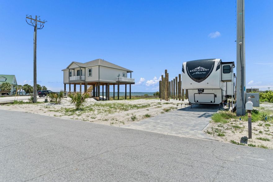 &#127796; Build Your Dream Beach Home on Navarre Beach -- Pilings and House Plans Included! &#127965;&#65039; Imagine starting your coastal lifestyle with a major head start -- this private water-view lot on beautiful Navarre Beach comes with pilings already installed and custom house plans that convey with the lot, saving you time and money on construction! With no HOA restrictions, this ready-to-build lot is perfect for your custom beach retreat. A recent 2022 survey was completed, stone pavers were added in October 2022, and water and sewer taps are already in place, making your build smoother and faster. Just a short walk or bike ride to white-sand beaches, the iconic Navarre Beach Pier, Juana's Pagodas, and the stunning Gulf Islands National Seashore, this location blends relaxation with adventure.