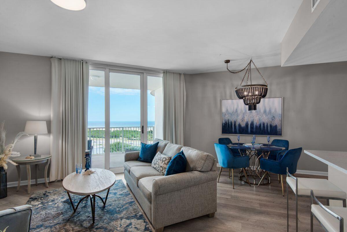 Ideally located in the heart of Destin, this one-of-a-kind two bedroom condo boasts exceptional views of both the Gulf of Mexico and the Choctawhatchee Bay. Perched on the 11th floor of The Palms of Destin, unit 11102 was completely remodeled in 2021 and is characterized by soft tones and coastal decor. Recent updates include new LVP flooring throughout, new light fixtures and ceiling fans, stainless steel appliances, quartz countertops in the kitchen and bathrooms, custom backsplash in the kitchen, all new plumbing fixtures, a new washer and dryer, new living room and dining furniture and new paint throughout the entire unit. Additional features include gulf views from the master bedroom and two spacious balconies offering views of both the