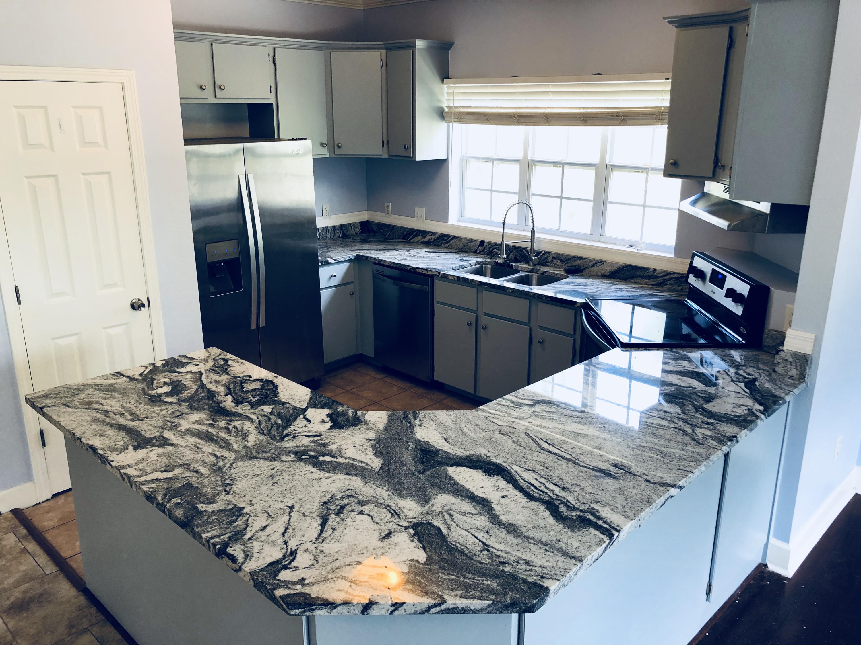 Just remodeled, the kitchen has new stainless steel appliances, and beautiful granite countertops. This home has nearly 1200 sq ft of living area and approximately 1200 sq ft of garage space. This house was built on pilings and the bottom was turned into as an enclosed garage layed out in 2 double depth bays. Large living room with a separate dining room which could easily be turned into a 3rd bedroom or office if desired. Located on a dead end street this home offers a convenient location near 30A. There is a boardwalk along the county easement to the Bay, providing easy access for paddle boarding or kayaking. There is also boat access at nearby Cessna Landing located within 1/2 mile of the property.