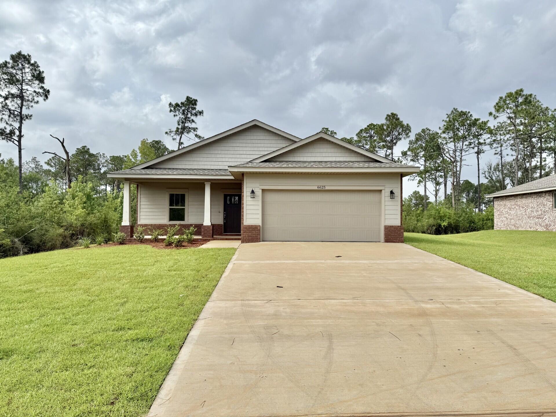 Located in an X flood zone, this exceptional new home features many upgrades throughout. Clad with the timeless durability of brick, cement fiber board accents, and an architectural shingled roof. Interior offers luxury vinyl plank in the common areas, visually pleasing neutral tile in the baths and laundry room, and carpet in the bedrooms. Custom paint color is accented with a wide baseboard, beautiful crown molding, and spectacular tray ceiling accents in the master bedroom, dining and entry area. Transom windows over the hall entryways provide a high-end custom touch. Stainless steel appliances including refrigerator, stunning shaker style cabinets, and granite throughout finish the home exquisitely.