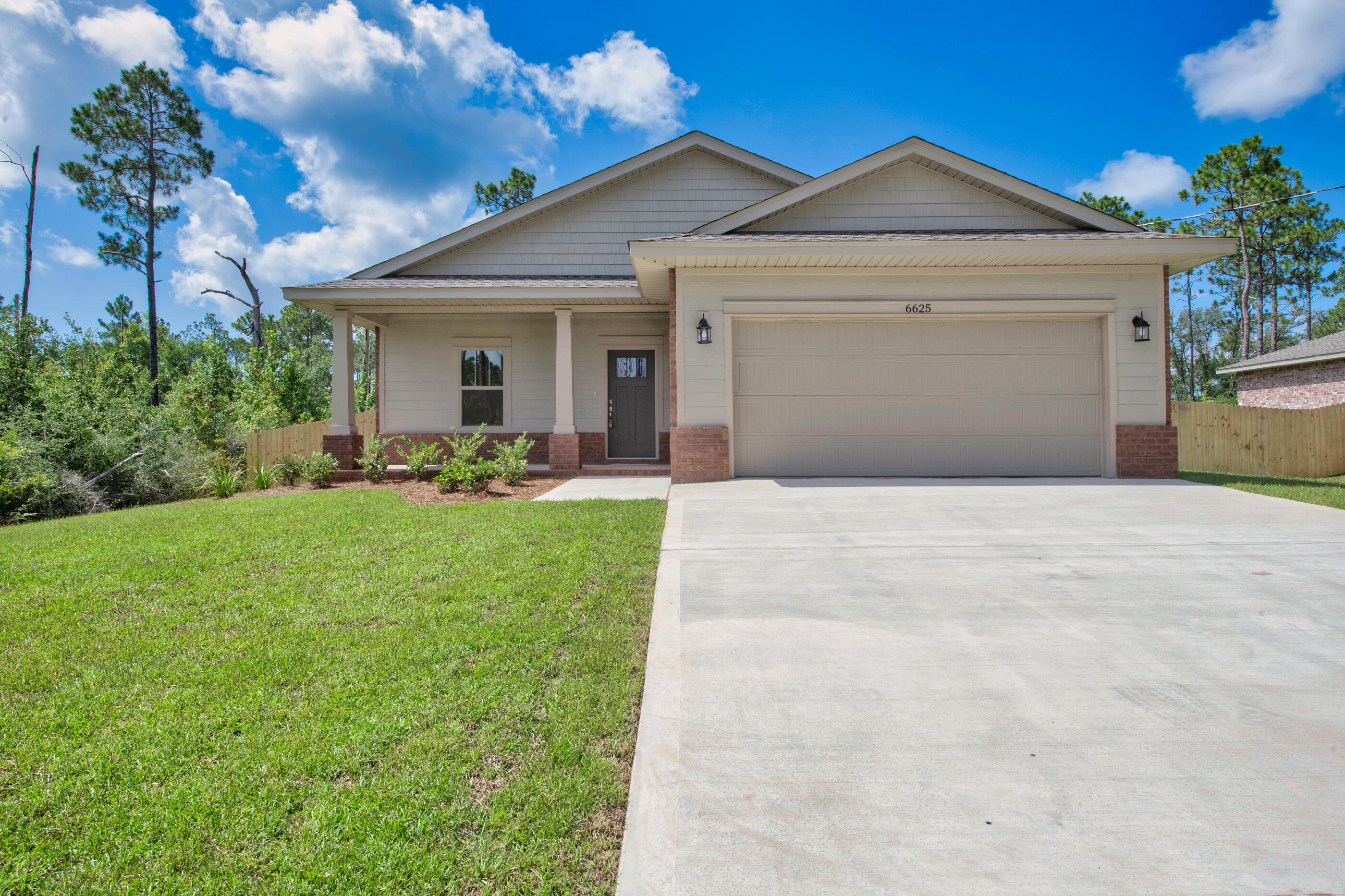 Located in an X flood zone, this exceptional new home features many upgrades throughout. Clad with the timeless durability of brick, cement fiber board accents, and an architectural shingled roof. Interior offers luxury vinyl plank in the common areas, visually pleasing neutral tile in the baths and laundry room, and carpet in the bedrooms. Custom paint color is accented with a wide baseboard, beautiful crown molding, and spectacular tray ceiling accents in the master bedroom, dining and entry area. Transom windows over the hall entryways provide a high-end custom touch. Stainless steel appliances including refrigerator, stunning shaker style cabinets, and granite throughout finish the home exquisitely.