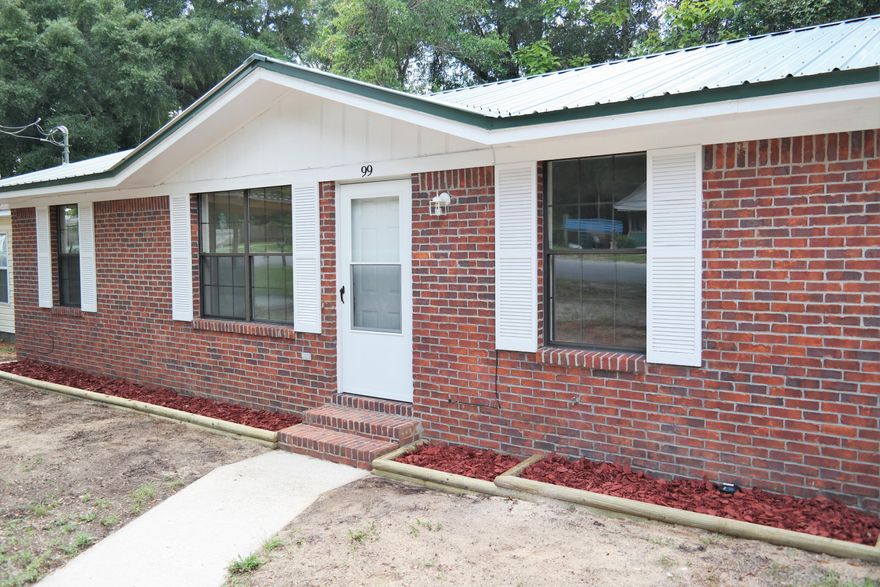 You won't want to miss this totally renovated brick home in the city limits of Defuniak Srings. 2016 renovations include new metal roof; New paint & tile floors througout; Garage converted to 3rd bedroom; New countertops, tile backsplash and new appliances in kitchen. HVAC is a newer unit, but was installed at an unknown earlier date. This is a quiet neighborhood and would make a great starter home or rental. Move in ready, so schedule your showing today!