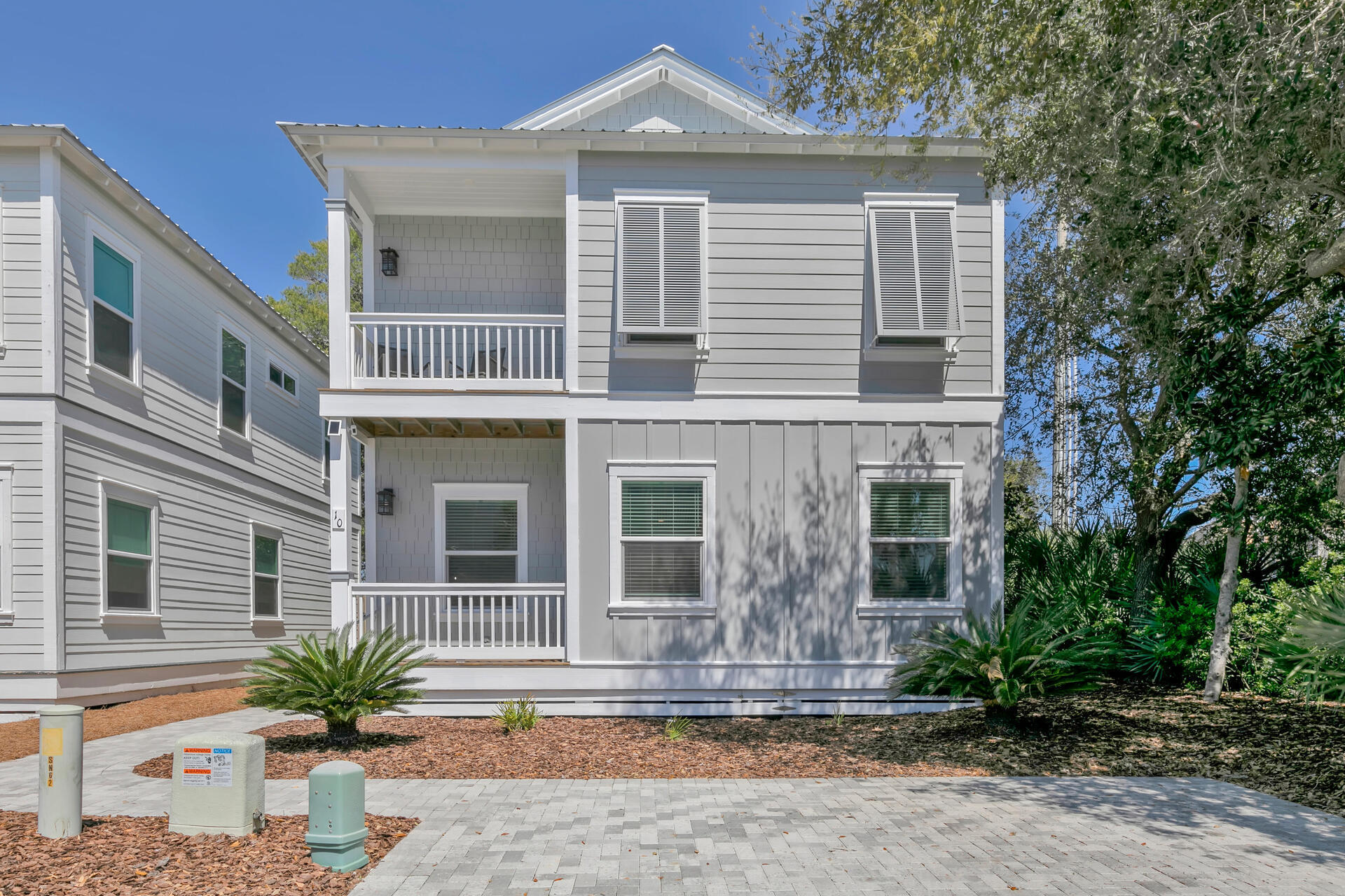 South of 30A in Blue Mountain Beach, this  2019 built 4 BR 3 Bath home is an easy walk to the beach.  With Gross Rental Projections of $83,500, a bedroom and full bath on the main level and 3 more Bedrooms and 2 Baths upstairs, it's a perfect vacation rental or primary home.  The spacious master suite features its own private balcony, walk-in closet and master bath with double vanity and shower. This home is Energy efficient and built to the newest building codes, with impact windows and doors, metal roof, 2 A/C units, spray foam insulation in the ceiling and north walls, tankless water heater. Design upgrades include shiplap walls, luxury vinyl floors, quartzite countertops, upgraded cabinets with glass doors, stainless appliances, new area rugs and beautifully furnished  throughout.