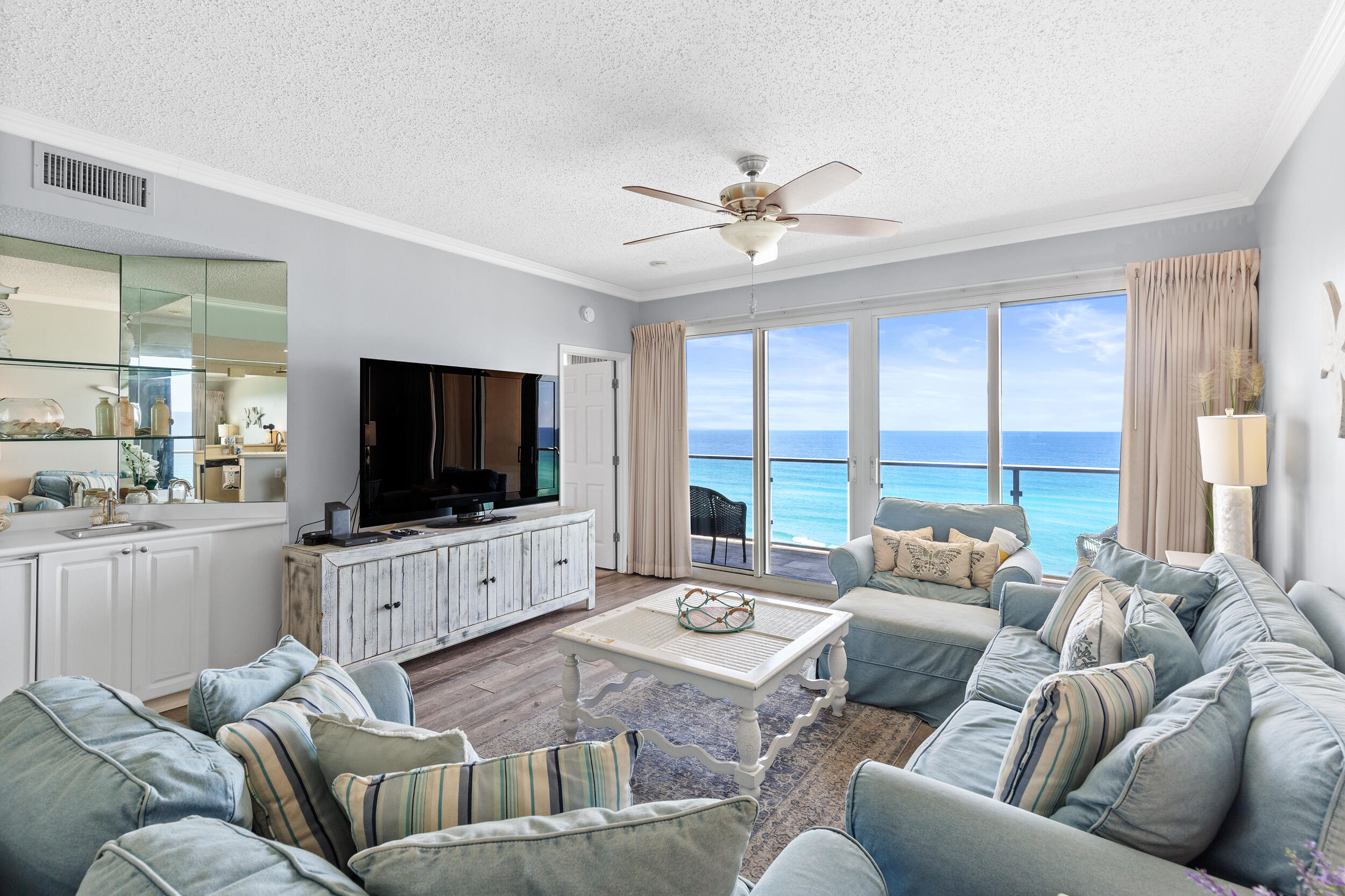 UNBELIEVABLE VIEWS AND DEEDED PRIVATE GARAGE PARKING SPACE CONVEYS with this 8th-floor unit at Sterling Sands Beach Resort. $82K NET REVENUE IN 2021, YTD $71K. Unit 710 is the larger two-bedroom units with gulf views from both the living room and spacious master bedroom. The glass rails along the big balcony maximize views of the Gulf of Mexico and the beach (accessible from both living room and master bedroom). This condo offers a clean, coastal look and comes fully furnished with lots of attention to details. The second bedroom is big enough to accommodate 4 people! Additional features; crown molding, Corian kitchen countertops, stainless appliances, full size washer dryer, owner's closet, fresh paint throughout, new vinyl flooring and outside storage.