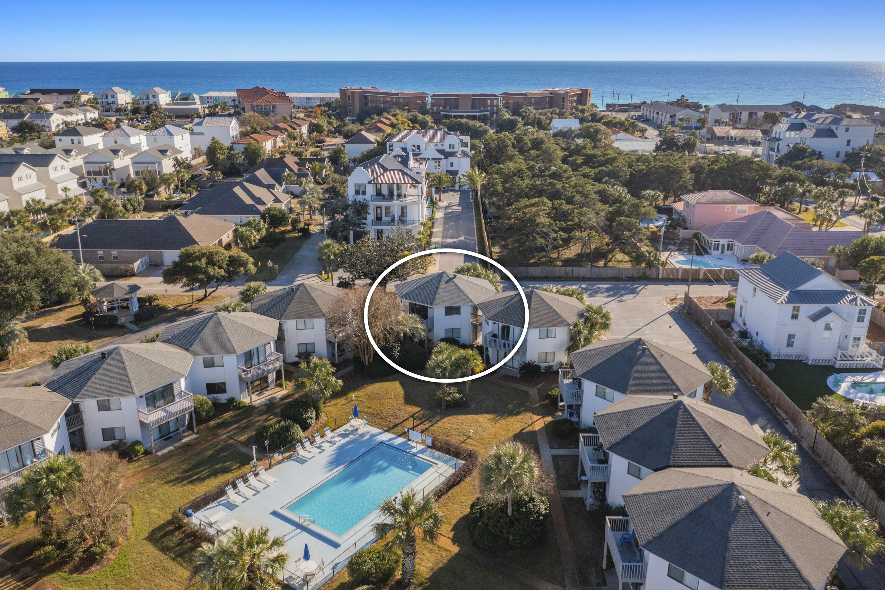Discover the allure of coastal living with this exceptional 2-bedroom, 2-bathroom condo in Crystal Village. Nestled on the South side of the community, this gem offers a prime location just steps away from the pristine white sandy beach. Enjoy the view from your private balcony overlooking the sparkling pool, creating a tranquil retreat right at home.This fully furnished condo is a turnkey haven, ready to be embraced as a permanent residence or a vacation rental. The tastefully appointed living space seamlessly blends comfort and style, providing a welcoming atmosphere. The master bedroom includes an en suite bathroom, providing a private and convenient retreat for its occupants. The second bedroom, does