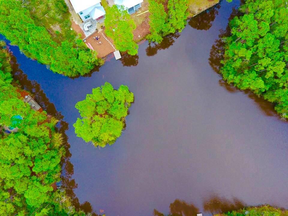 *Tap Fees Paid*Priced to Sell* Act Fast**Perfect small subdivision in Miramar Beach area on freshwater Lake/Pond with creek going into Choctawhatchee Bay. Great location to build a home with large trees. Close to local shopping at Silver Sands Outlet Mall. Utility easement gives property larger appearance. Lot is at end of cul-de-sac. Lot dimensions should be verified by purchaser.HOA currently inactive.