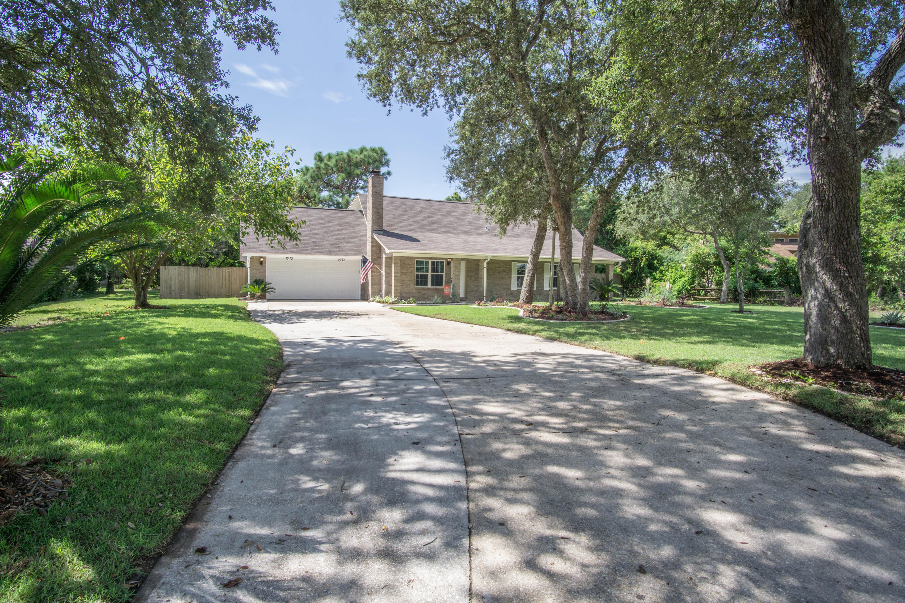 Its hard to say what the best part about this property is. The large lot located on a cul-de-sac, the curb appeal, the wood floor, the marble countertops throughout the home, the wroght iron railing, the tall ceilings, the open floor plan, the finish work; you decide. This home has been completely redeveloped from the ground up. This beautiful house sits on over a third of an acre boasting 5 bedrooms and 2 and a half bathrooms. There is high end wood laminate flooring in the living areas to include actual dark stained oak stairs to the second floor. The kitchen has marble counter tops complimented by travertine backsplash with off white cabinets and stainless steel appliances. $16k worth of hurricane windows have been installed on this property to include a new reinforced garage door.