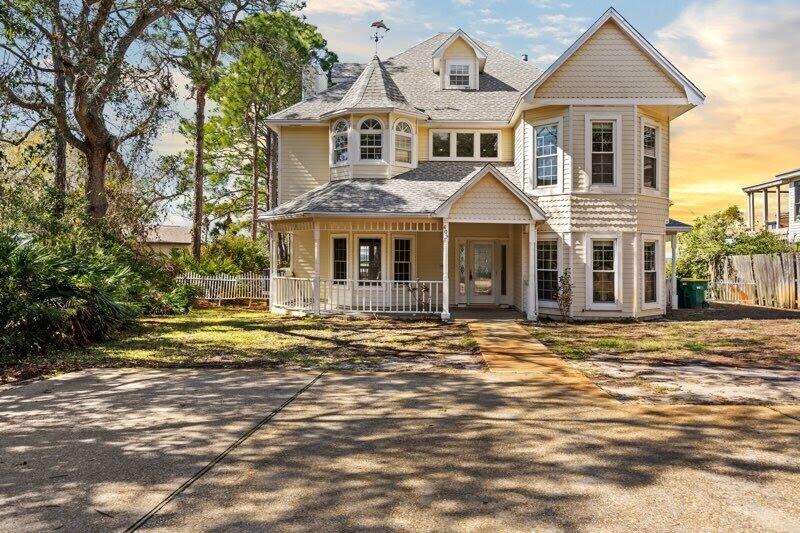 ***Back on the market, no fault of the seller*** Discover Destin's hidden gem, where coastal elegance meets ultimate privacy on a rare bayfront lot just under 1 acre in size. Nestled among lush, mature trees, this expansive property offers a serene escape with 85 feet of private waterfront along Choctawhatchee Bay. With no HOA restrictions, you have the flexibility to renovate, expand, or even build your dream waterfront estate, a truly unique opportunity in one of the most coveted areas of Destin. This spacious 3,524 sq. ft. home features six bedrooms and five and a half bathrooms, making it perfect for large families, vacationers, or those who love entertaining. The primary suite is a peaceful retreat, complete with a private balcony overlooking the water so you can watch the gentle waves every morning. In addition to the primary bedroom, the remaining five bedrooms are all extremely spacious. The expansive two-level outdoor deck is ideal for hosting guests or unwinding while watching stunning sunsets. A private dock extends into the bay, offering direct access to the Gulf, perfect for boating, fishing, paddleboarding, or simply enjoying waterfront living. Imagine launching your boat from your backyard and cruising to Destin Harbor, Crab Island, or the Gulf's world-famous white-sand beaches in minutes.
This property's secluded, forested setting ensures unparalleled privacy, a rare find in such a prime location. With nearly an acre of land, there's ample space to create your custom outdoor oasis, whether you dream of a resort-style pool or building a new custom property. Schedule your private tour today; opportunities like this don't come around often!