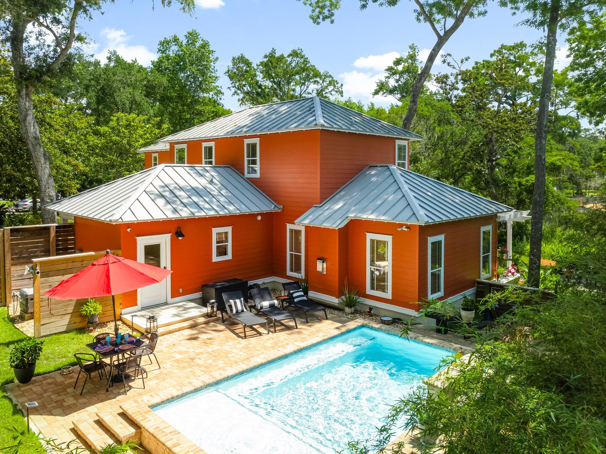 Waterview! Tucked away in the enclave of Moores Landing, this home is a quiet coastal retreat in a central location - just minutes to Grand Boulevard, Sacred Heart, and the west end of 30A.The main home has a bedroom, full bath and living area on the first floor. The master suite occupies the full second story. Step out onto your balcony, relax in the hammock, and get lost in the sounds of the natural setting. Enjoy outdoor living at its finest with a stunning water view, lush landscaping, spacious porches on multiple levels, and a new pool that converts to a spa with the flip of a switch.The third bedroom and bathroom are above the oversize 2 car garage which boasts a workbench, cabinets and a separate storage room.