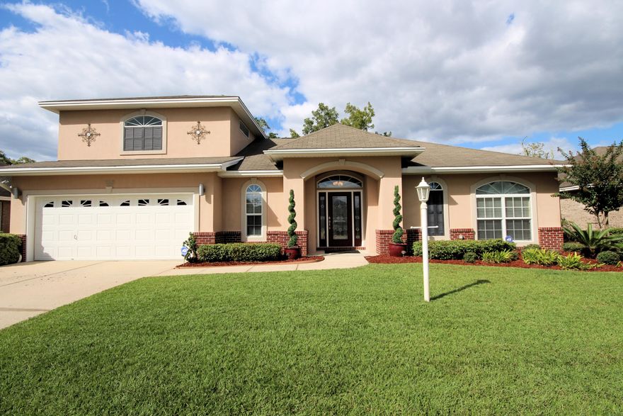IMMACULATE CUSTOM BUILT ONE OWNER HOME! This 4 Bedroom home begins with Updated Landscaping accented with yard lights on timer. Home features Impact Glass Windows, Renai Tankless Water Heater, Alarm System, Bose Sound System. Enter thru the Front Door which is obscure cut-glass which leads into the foyer, engineered hardwood floors, Wet Bar. Chef's Kitchen with generous Pantry and Breakfast Bar lit with pendant lighting. Kitchen and Bathrooms have Custom Maple Cabinetry throughout home with Euro Stainless Pulls, Black Pearl Granite Countertops in kitchen and Stainless Steel Appliances and SS Backsplash Leads out into the Main downstairs living room perfect for entertaining, which leads out to the outdoor Oasis, Pool Area, where you have your own private Saltwater Pool with composite decking to surround. Natural Gas Quick Connect/ Disconnect for your  attaching for outdoor cooking.  Master Bedroom Suite is downstairs, with huge Walk-in Shower and Walk-In Closet. Laundry Room is situated centrally. Upstairs is huge Bedroom or Recreation Area with Full Bathroom,  then you walk thru to an additional Bedroom or could be a Office. Walk-in Attic Storage Area located at top of stairs, used for Holiday Closet or Storage Area. Too many features to mention. Schedule  your Private Showing.