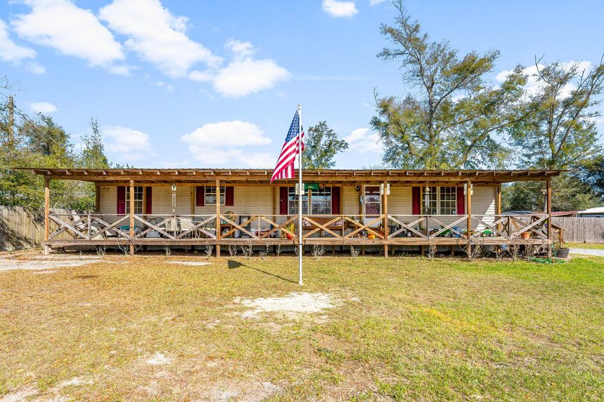 Imagine starting your mornings on the expansive 60-ft covered front porch, sipping coffee while listening to the birds sing and soaking in the beautiful Florida sunshine. Nestled on a generous 0.52-acre lot, this 3-bedroom, 2-bathroom home also features an additional office/bonus room or extra storage space, offering flexible options to fit your lifestyle. Step inside to a thoughtfully designed layout featuring a spacious kitchen with ample cabinet and countertop space, perfect for meal prep and entertaining. Gather around the kitchen island, where breakfast conversations and memories are made. The master bed suite is an large 16.9x 12.4, with a large master bath boasting a soaking tub and separate shower, ideal for unwinding after a long day. The home also features a brand-new metal roof (2024), recently installed by Johnson Roofing Solutions. Zoned for Bozeman School, the property includes a fully fenced backyard, perfect for privacy, pets, or entertaining. The seller is generously including an American Home Shield Warranty (up to $650) and is willing to offer a flooring credit with any reasonable offer. Important Note: Shed does not convey.