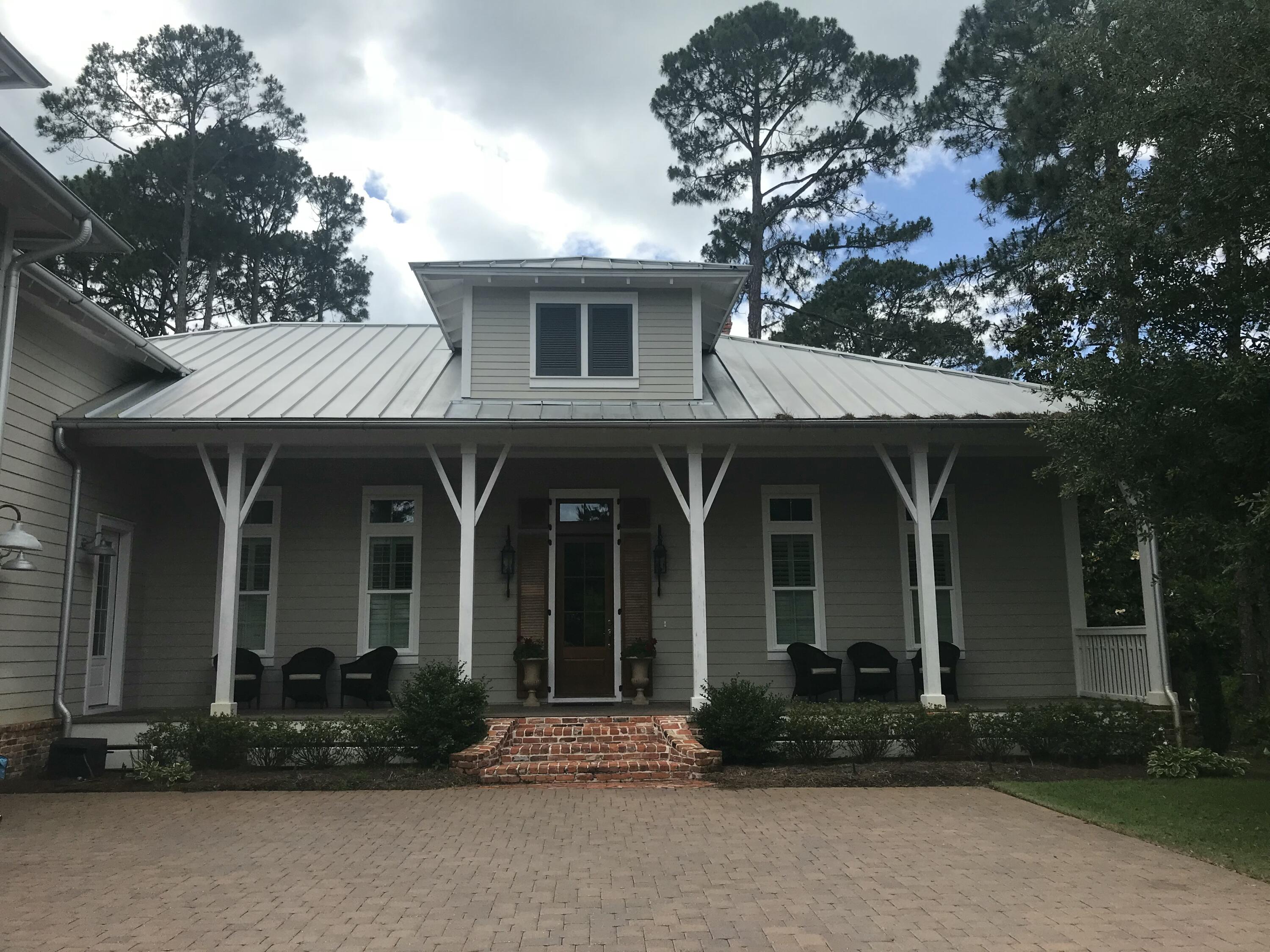 Additional pictures forthcoming. This magnificent custom-built home located in the quaint subdivision of Sea Dunes is worth consideration. Located within walking distance of the beautiful Emerald Coast along Scenic Hwy 30A, the home sits on one of the largest lots on a cul-de-sac offering privacy, peace and quiet.As you enter the home notice the domed ceiling and special wood inlay floor pattern in the foyer. The study to the left has ample built in cabinets/shelves and a coffered ceiling. Rustic white oak floors are throughout. The first floor has an independent HVAC system. Additional features on the first and second floor include: "A large master suite featuring a bedroom with beamed ceiling, large walk-in closet and bathroom with double vanities, shower, and freestanding soaker tub. The suite has its own HVAC system.
"A large wide-open family area offers ample space for the living room, dining area and kitchen. Notice the built-in cabinets/shelves, sound system, masonry fireplace with gas starter and 12ft beamed ceilings. 
"A guest bedroom room, full bathroom, and walk-in closet
"Powder room
"Laundry room 
"Walk out to the attached garage with space for 2 cars and a golf   cart.

The guest suite on second floor has with its own HVAC system includes:
"A living area with a built-in king size Murphy Bed, loft play         area, closet, kitchenette with sink, microwave, and mini         refrigerator, 
"A bedroom with a large closet
"A full bathroom

Additional features of the house include:
"Central vacuum throughout
"Built-in pest control system (contract required for pest service)
"Plantation shutters 
"Most furnishings convey (list available)

Enjoy sitting and relaxing on the very large front porch or screened in back porch. This home will be an excellent primary residence or second home in move-in condition.
