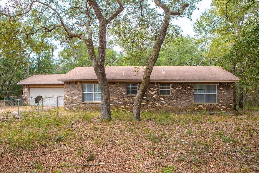 House is in Probate. Being Sold AS-IS. This two-bedroom, two-bath home sits on over an acre of land. Great screened-in porch, two-car garage and fantastic fenced-in yard.