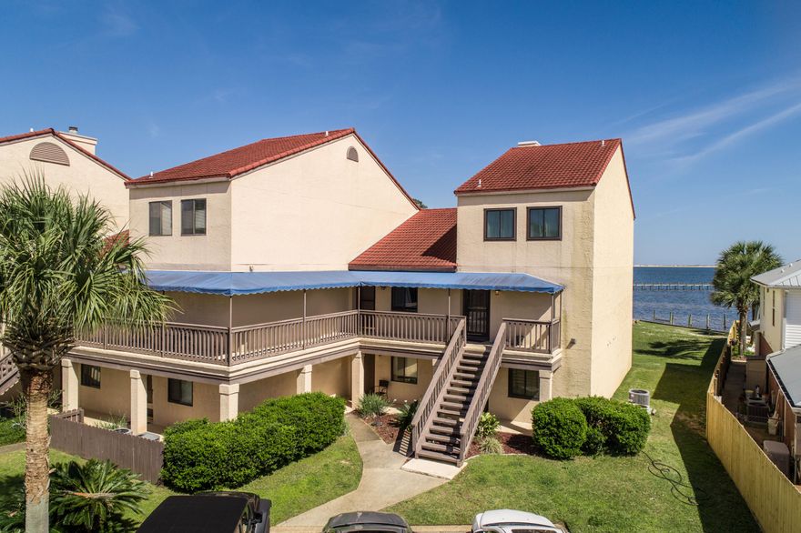 Welcome to Navarre living at it's finest! This completely renovated condo offers stunning Sound views and water access with a community pool and gated entry. Conveniently located on Hwy 98 (Navarre Parkway) just 2 miles to Navarre beach and 12 miles to Hurlburt Field. The Kitchen has been completely renovated with new cabinets, stainless steel appliances, granite countertops, and subway tile backsplash with a built-in microwave. The bathroom has also been completely renovated with a shower/tub combo with subway tile, new vanity with granite, toilet and all new faucets and fixtures. All new wood look tile flooring throughout the entire unit as well as fresh paint. This condo would be your very own private beach retreat. Don't miss the opportunity