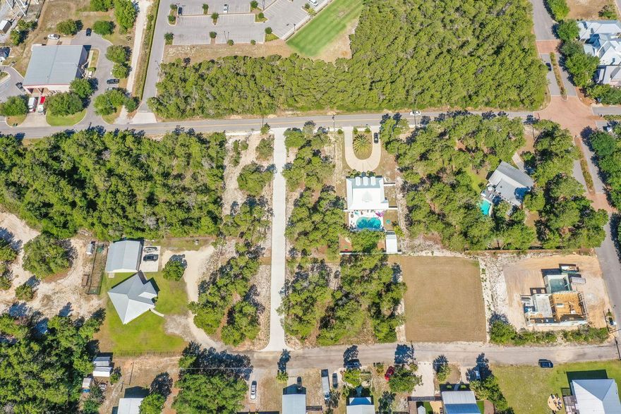 Located in the new development of La Bella Vita Estates, Lot 3 is located less than a half mile to the Inlet Beach public beach access and just steps away from the shops and restaurants of 30Avenue. This 1/3 acre lot is wooded and can accommodate a pool, carriage house and up to a 5,000 square foot home. This quiet neighborhood in Inlet Beach offers the conveniences of Rosemary without the crowds. Lake Powell public boat launch is a short two mile distance from this lot. Whether it is lake or beach living you desire both are just moments away from this unique lot.