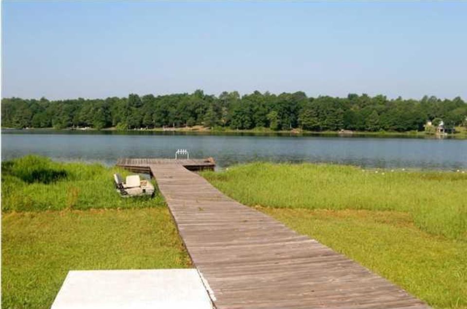 WATERFRONT PARADISE AT AFFORDABLE PRICE!!! Enjoy the therapeutic views of the desirable Lake Kings, known as main attraction for FISHING lovers for its Bass and other wildlife!!! Only 30 minutes away from our world renown white SUGAR beaches!!! This property is an investment opportunity, currently rented for $750 monthly. NEW METAL ROOF in 2016, A/C, stove and refrigerator were replaced within the last 3 years. Cathedral ceiling. Conveniently open living & dining. Plenty of cabinetry & a breakfast bar. Open porches for best enjoyment of the relaxing lake scenery, while grilling and/or hanging out with your fav's!!! Picnic and recreational park nearby! Property won't be available for showing until July 2nd, 2017. Pictures were taken before last lease. Newer pictures will be uploaded soon.