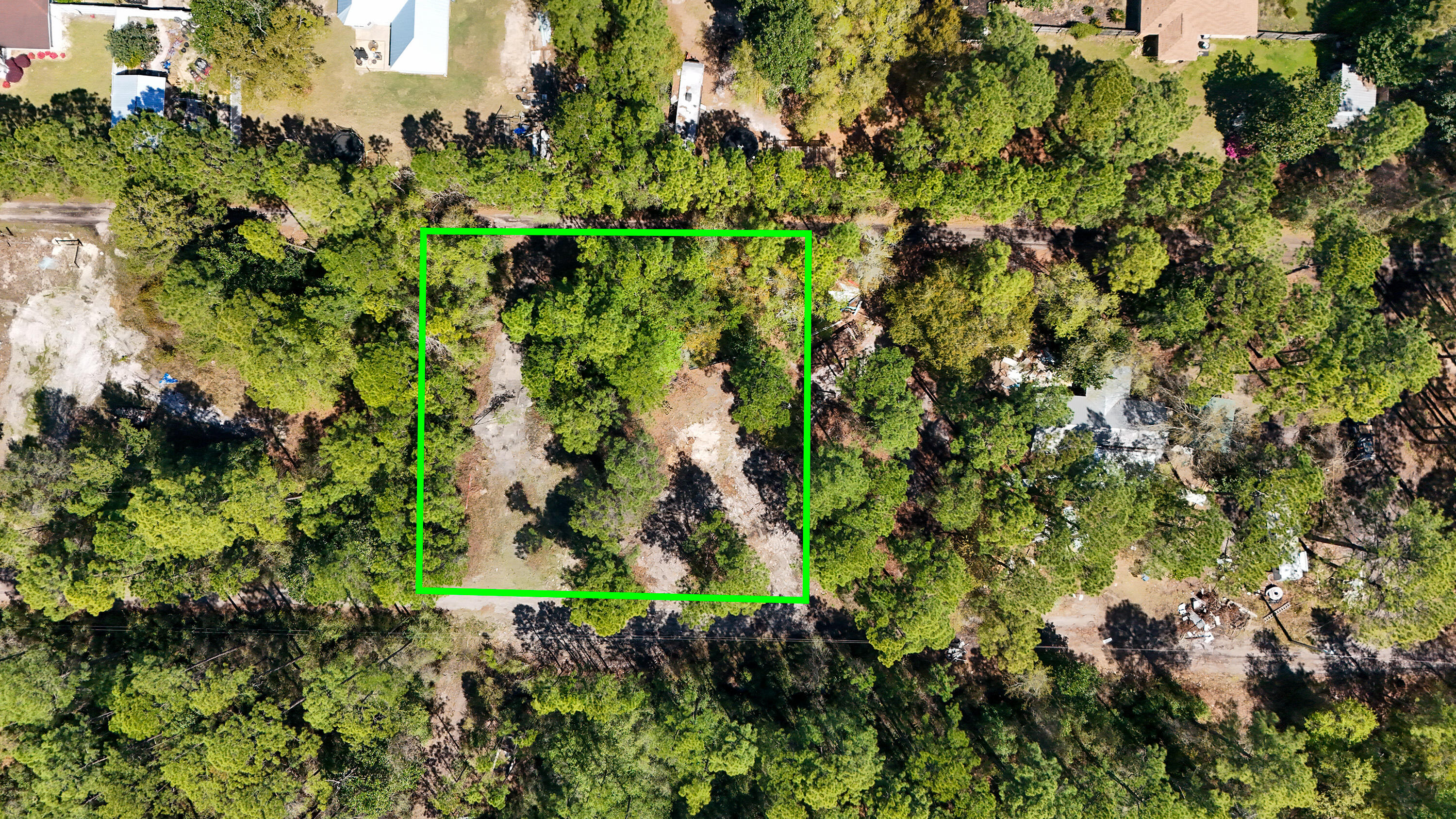 Half acre lot on a quiet private road off of Mussett Bayou Road.   NO WETLANDS. 15 minute drive to restaurants, beaches, and shopping.