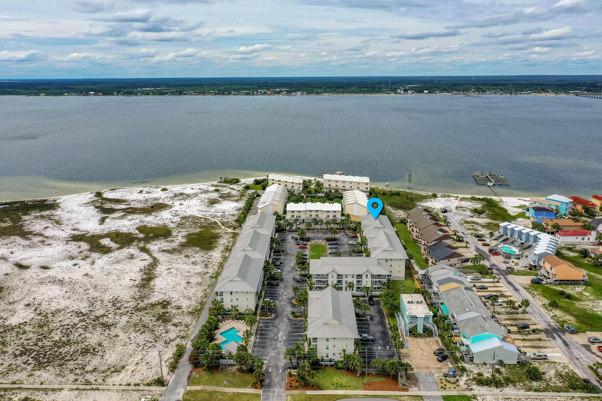 SPECTACULAR SUNSETS! Views are breathtaking from this beautifully renovated 3 BED/ 2 BATH TOP FLOOR END UNIT overlooking the Santa Rosa Sound.From the moment you walk in you will be WOWED by the upscale furnishings and decor...This WOW FACTOR includes bead board ceilings, granite counter tops in the kitchen, full size laundry room, cultured marble counters in the bathroom, stainless steel appliances, shiplap walls, hardwood floors and tile, ceiling fans, recessed and custom lighting...Enjoy WATER VIEWS from every room except one. Located between the Gulf and the Sound, the beach access is a short stroll.Gulf Island offers a community pool, showers, grilling and restrooms. Fully Furnished and would make a perfect short term rental or primary home.