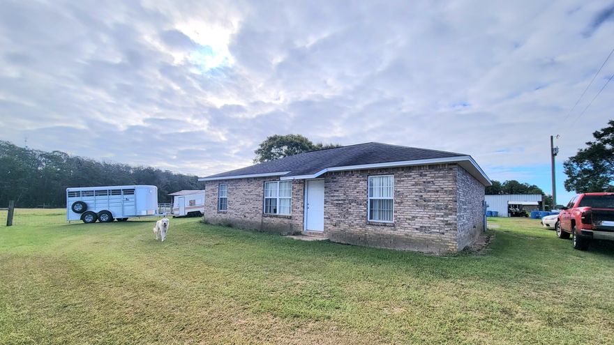 22.5 acres ready for horses or cattle with a 2008 built all brick home with 2 bedrooms, and 2 bathrooms.  Such a peaceful setting with your pastures and barns/sheds where you can see them.  Seasonal creek borders the property on the east side of the  appx. 15 acres fenced and cross-fenced for livestock.   Home sits middle of the property with a total of 5 barns/sheds -one small hay barn, a large Pole barn at the back with an alleyway, third is a  pole barn for feeding horses and forth  barn is being used as a workshop nearest to the house (no value given due to age and condition)  Property located appx 20 miles north of DeFuniak off Hwy 331 N and is appx. 10 minutes to Paxton schools.  Shopping near to Florala, Andalusia, DeFuniak and Crestview.