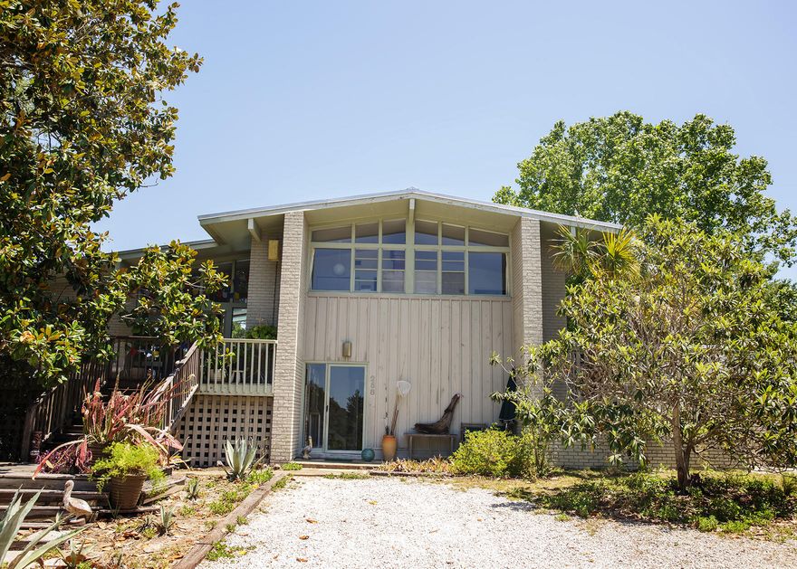 This 30A original was inspired by the stylings of Frank Lloyd Wright... with a beach flare! Home sits on a exceptionally rare 1/2 acre near the beach. The two living/lounge areas, industrial level chef kitchen, and 1960's airstream pool-house make this piece of local history remarkably unique. Words can not explain the potential in this home. It has undergone many improvements without ever losing the integrity of the original design. Schedule your showing to see how a house can be Retro, Modern and Coastal all at the same time. New access to beach is a direct shot down Hillcrest. Home to be sold as is. See Agent notes for details.Roof was replaced 2012 (25year warranty). New AC 2009.New pool liner 2013