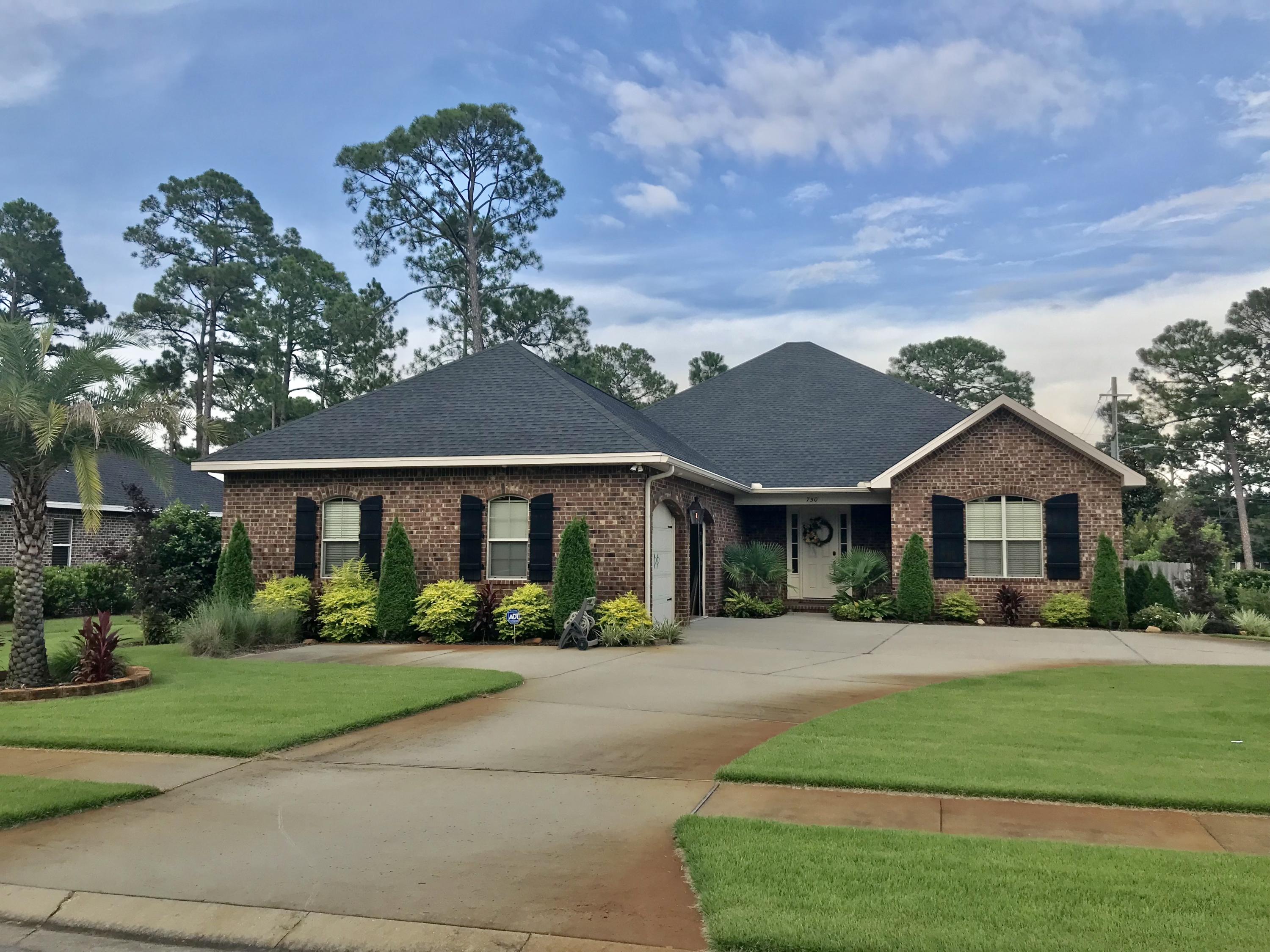 Welcome home to Magnolia Woods! This stunning home is located on an oversized corner lot with outstanding custom landscaping, an extra large circular driveway, and extra parking pad for your boat! Inside boasts new wood-look tile flooring, newer paint, stainless steel appliances, screened porch, 4 bedrooms and 3 full baths! The exterior landscaping compliments the oversized lot while the circular driveway creates ample parking and room to play! A fully fenced back yard gives privacy and provides lots of room for outdoor fun. The all brick home includes a gas lantern between the two garage doors, a gas water heater with instant heat, and electric HVAC. Like new, this home is priced to go! Please make an appointment today!