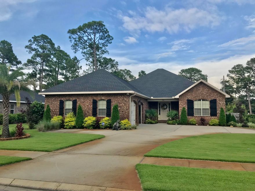 Welcome home to Magnolia Woods! This stunning home is located on an oversized corner lot with outstanding custom landscaping, an extra large circular driveway, and extra parking pad for your boat! Inside boasts new wood-look tile flooring, newer paint, stainless steel appliances, screened porch, 4 bedrooms and 3 full baths! The exterior landscaping compliments the oversized lot while the circular driveway creates ample parking and room to play! A fully fenced back yard gives privacy and provides lots of room for outdoor fun. The all brick home includes a gas lantern between the two garage doors, a gas water heater with instant heat, and electric HVAC. Like new, this home is priced to go! Please make an appointment today!