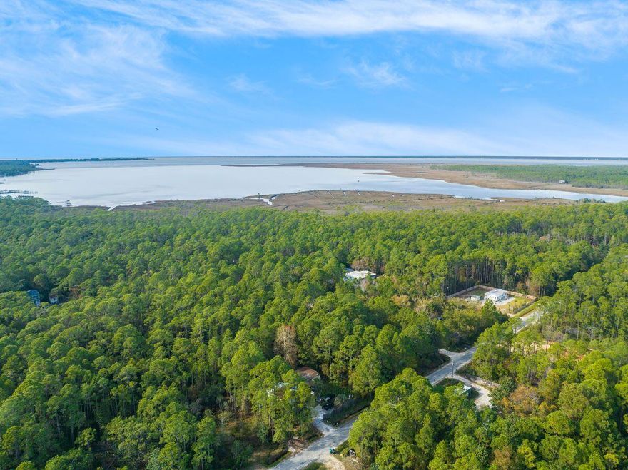 This beautiful lot centrally located between Destin and 30A provides a level and buildable surface. With road access as well as proximity to the Chawtachaee bay, this lot is the perfect place to build a forever home.