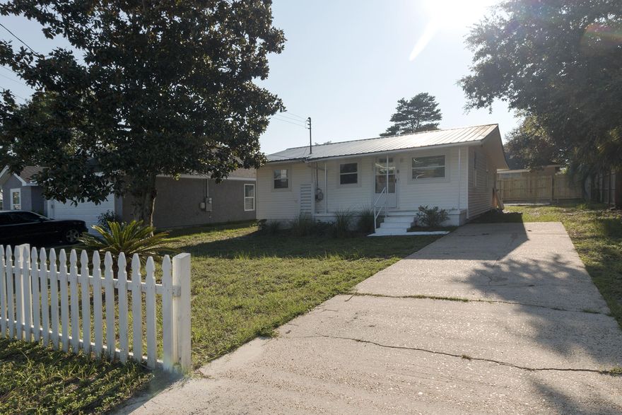 Perfect investment or starter home. This 2BR/1BA, 840SF Home is located close to shopping, dining, entertainment, & the beach & Lake Powel. This home is situated on a 0.12 acre lot in a quiet neighborhood. This home features hardwood floors throughout the living & bedrooms and tile in the bathroom. The living room is a large & opened with recessed lighting & plenty of windows. The kitchen has new appliances & access to a large laundry room/enclosed porch. This home would make a perfect investment property or start home for a first time buyer.