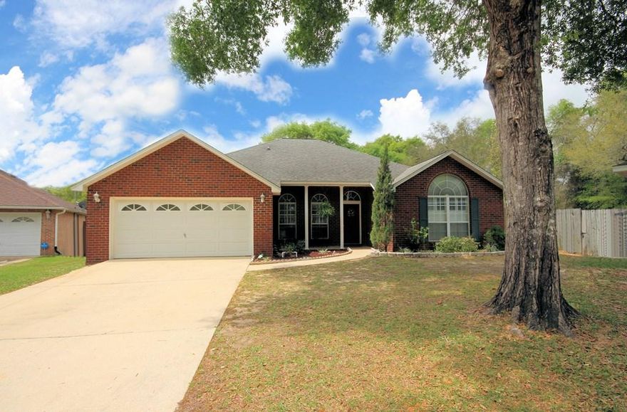 GREAT home south of I-10 in Crestview with a large yard featuring a kid's area as well as a pool and deck area. You will enjoy this low maintenance all brick home at the end of a cul-de-sac in the Pinnacle Point neighborhood. The split bedroom plan of this home features lots of open living space. When you enter through the front door, you will find the formal dining room accented with columns that is open to the living room featuring high ceilings and a fireplace. The roomy kitchen and convenient breakfast nook overlook the large back yard. The master suite has a walk in closet and the bath will pamper you with a garden whirlpool tub, tile shower, and double vanity. Bedrooms #2 and #3 are on the other side of the house and bedroom #4 with TWO closets is just off the foyer. CLICK MORE The amazing back yard is sure to please an active family with a pool and deck area as well as a kids play area! Be sure to see this one before it is gone!!