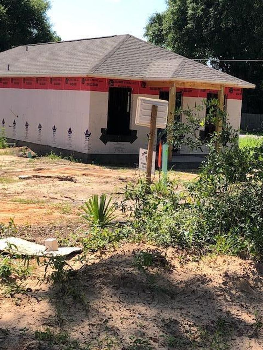 In the continuing effort to offer affordable homes this home is NOT short on Quality and offered to those who would rather own and rent.  Luxury, lock-n-lay vinyl throughout, more cabinet space than our larger, 3/2 home, granite counter-top, marble baths.  All window trimmed out. Corner lot, but the Street ROW is 75 feet, wider than most, and home sits a distance from the paved area of street.  Being a corner, one could add a free-standing carport entering from the side street.   Convenient to all conveniences.  Dimensional shingles and Energy Efficient!  Nothing cut but the size and price! Built by Local, Hometown Quality Builders.  Completion expected on or before 8/31/22.