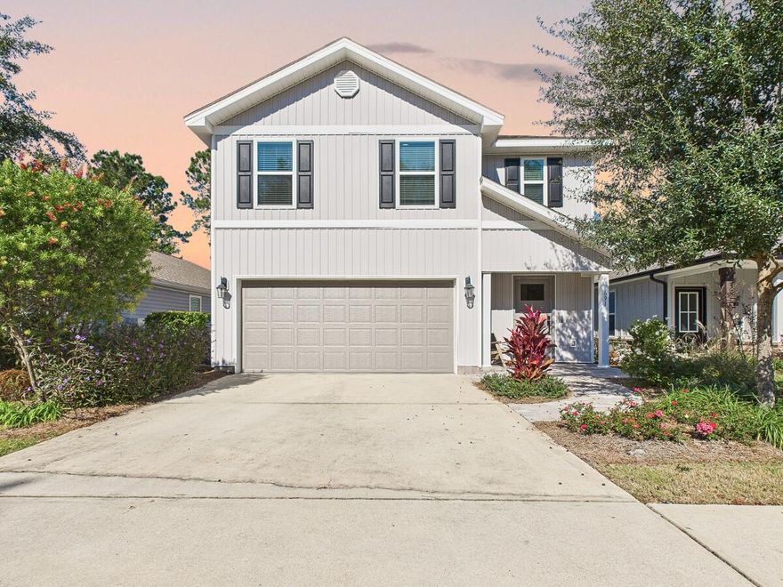 Priced to Sell!! Welcome to 691 Earl Godwin Road, a beautiful Florida home in the highly sought after Hammock Bay community of Freeport. Located in the charming Mill District, this five-bedroom, three-bath home offers a fantastic blend of comfort, convenience, and access to some of the most impressive amenities in the area. Built in 2019, this two-story design features a smart and flexible layout with one bedroom and a full bath on the main level (ideal for guests or multigenerational living) while the remaining bedrooms, including the spacious primary suite, are upstairs. The open-concept main floor creates an easy flow between the living, dining, and kitchen areas, and the fenced backyard and two-car garage add to the home's everyday functionality. Additional updates include a tiled kitchen backsplash, new appliances, and pavered front porch and back patio.  The included washer and dryer make this home feel move-in ready and you'll love the plethora of closet space in this home.
Residents of Crescent Mill, one of Hammock Bay's maintenance-free neighborhoods, enjoy HOA benefits that cover cable TV with over 150 channels as well as full lawn care (including mowing, irrigation, mulching, and fertilization) giving you more time to enjoy everything Hammock Bay has to offer.
And, the amenities truly set this community apart. Hammock Bay spans more than 3,000 acres and features resort-style pools, a 24/7 8,000-sq-ft fitness center, a beautifully designed owners' clubhouse with gathering spaces, bar area, caterer's kitchen, and a private movie theater. Outdoor recreation is endless with lighted tennis and pickleball courts, basketball courts, playgrounds, a dog park, miles of walking and biking trails, and the Bay Club with its fishing pier. Sports enthusiasts will love the 60-acre complex with soccer and softball fields, sand volleyball, batting cages, and disc golf. The community also hosts frequent events and activities, creating a warm and connected neighborhood atmosphere.
Just 22 minutes from the sugar-white beaches of the Emerald Coast and conveniently positioned near both the Main and West entrances of Hammock Bay, this home delivers the best of coastal living with everyday ease.
