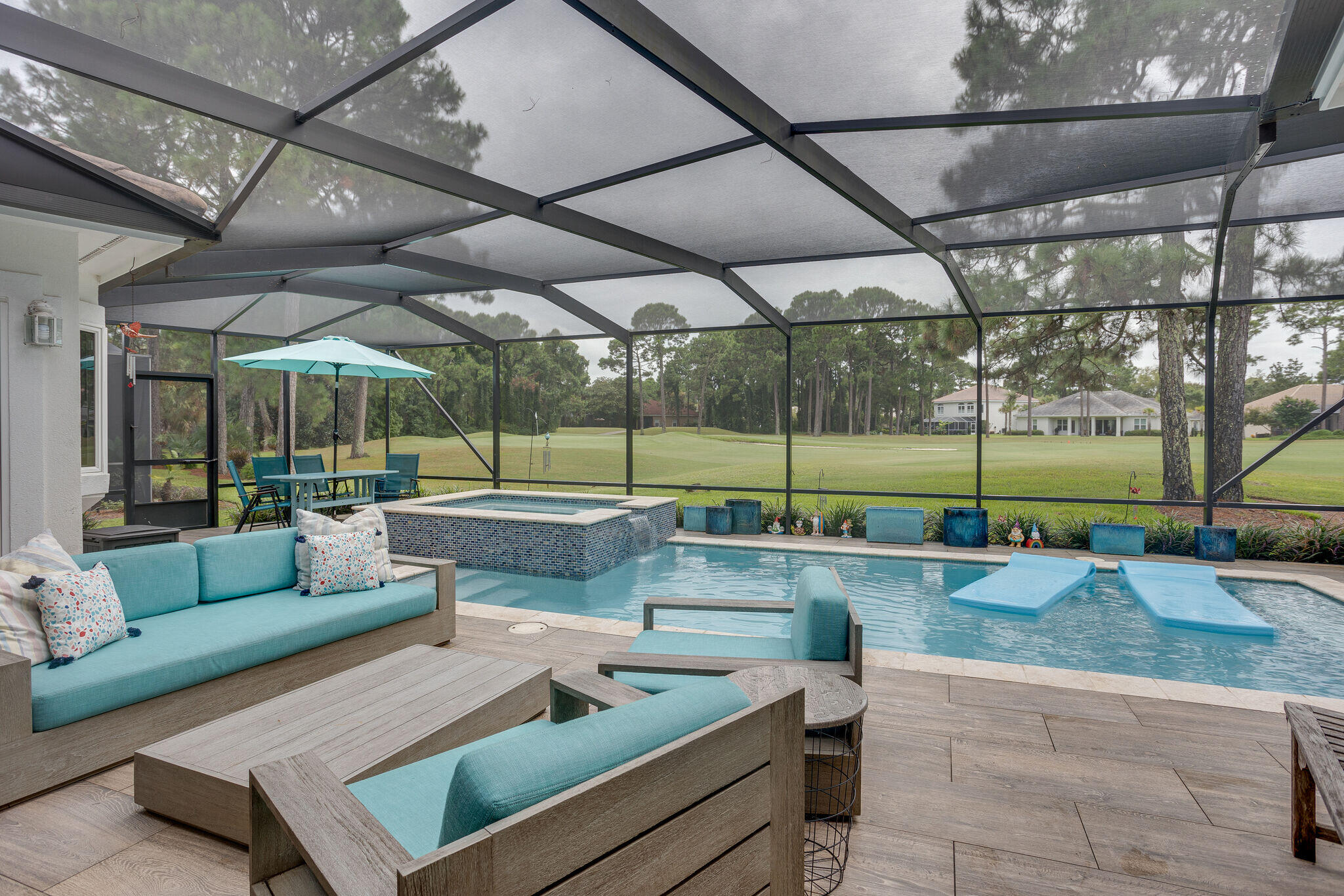 An incredible home for the price with over $365,000 spent for recent upgrades and improvements!  Located in a Beautiful Golf Course Setting on the fourth hole of Emerald Bay, it is specifically designed with Family Living in mind.  Click on the Photos to discover the very thoughtful touches put into this home for a ''Great Quality of Life''.  Relax in the new heated pool and hot tub while taking in the very serene golf course view.  High Barn Doors, Beautiful Quartz Countertops, and a Master Bedroom & Bathroom that are Gorgeous!  Emerald Bay...with its Gated Security, Family Friendly Amenities, and very reasonable HOA is a wonderful place to live.  Come See it Today, Make it Yours, and Love it Forever!
