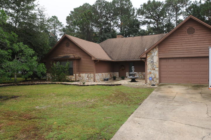 This lovely Bluewater Bay home is what you have been waiting for! Walk inside to find a spacious entry and large living room with stone fireplace and wet bar. Just off the living room is a spacious updated kitchen with a large breakfast nook. The kitchen and living room flow easily into the dining room as well. There is a good-sized butler's pantry and a laundry room just off the kitchen.There is wide plank engineered wood floors throughout, a bonus screened patio room overlooking the huge backyard with saltwater in ground Gunite pool and a shed for extra storage is tucked away in the back.All three bedrooms are large and have amazing closets while the two full baths feature extensive tile workThis home is in a great location, schools and restaurants are nearby and you are never far