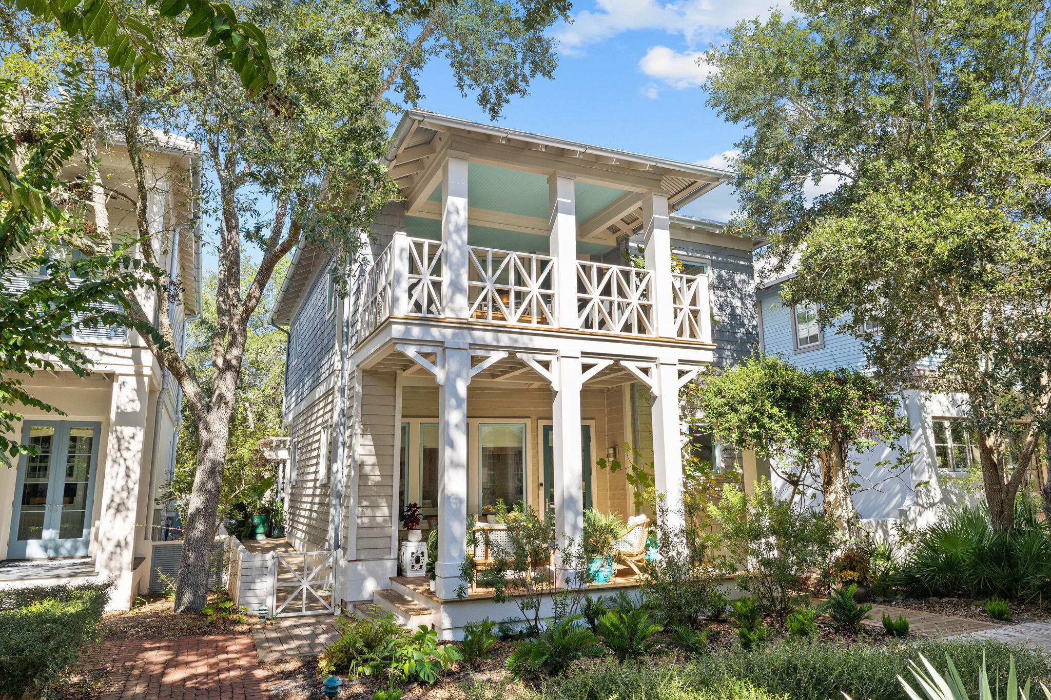 Architect Michael A. Piazza, designed this classic Caribbean cottage for the corner lot on the Kingston Pocket Park in Rosemary Beach, just steps from the Butterfly Garden, Owner's Pool & Pavilion, and the Dog Park all within a walk of 5 minutes of the Town Center. The exterior is a combination of three types of siding, two types of metal roofs, giving the appearance of a small Caribbean cottage that has been added onto over time. Renovated to add a 1st Floor Primary Suite with extensive closet, half bath for your guest, entertainers dream kitchen with high gloss white custom cabinetry, matt black custom island with 43'' Kohler workstation sink/cutting board, KitchenAid French Door Refrigerator & Dishwasher and 5 Burner Dual Fuel Thermador Convection Oven/Range all overlooking the living