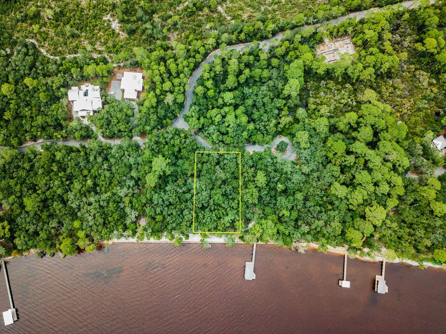 This over-sized homesite the The Estuary offers 125 feet of waterfront on the Choctawhatchee Bay with plenty of natural vegetation to maintain privacy around a future home. The custom home opportunities are endless! Enjoy direct access to the Bay and some of the best fishing in the area. The Estuary is a secluded, gated community surrounded by Point Washington State Forest with complete privacy yet a perfect location close to the beach, 30A, Santa Rosa Beach, Grand Boulevard + more.