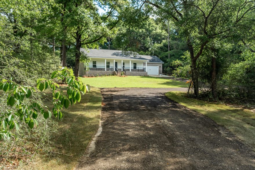 3.39 GORGEOUS WOODED ACRES comes with this BRAND-NEW HOME by quality local builder.  So close to town, this beautiful homesite is nestled in the woods for privacy, a true ''diamond in the rough'' in the new home market!  Home has been upgraded throughout to compliment a uniquely private and special setting.  Covered front sitting porch is waiting for rockers and lazy evenings.  Cathedral ceiling family room opens to kitchen w/work island & bar seating, cozy dining space, pantry, quartz countertops & upgraded mate black fixtures throughout.  Craftsman finishes in baseboards, window trim and doors.  Owners' suite has walk-in closet, tiled shower & double vanities. Laundry room has deep sink + extra closet. Covered rear porch, upgraded light fixtures, LVP thru-out, blinds on all windows.