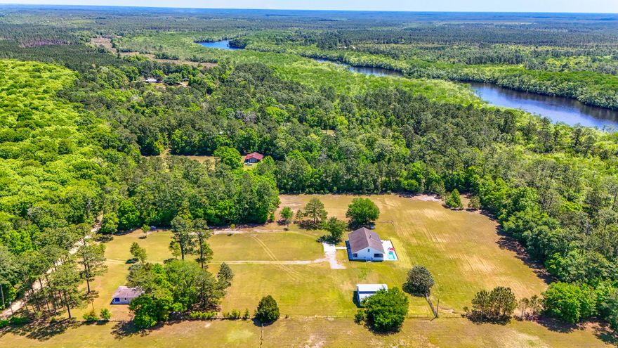 Bring your horses, boats and ATVs and endless possibilities. Main house and guest house must be sold together. This private, quiet equestrian property is conveniently located at the junction of Washington, Bay and Walton County lines. 2 well maintained homes on 5.5 groomed, green acres and pasture fenced for horses. The land is cleared, flat and perfect for horse dressage and arena. Dirt roads provide miles of trail riding opportunities. The property is located near Pine Log Creek, Choctawhatchee and East Rivers with easy access to public boat ramps for boating, jet skis, kayaking or paddle boarding. Within 2 miles of Pine Log State Forest with miles of off road biking trails and camping. 2 miles from newly established Operation Outdoor Freedom (outdoor opportunities for Fl Wounded