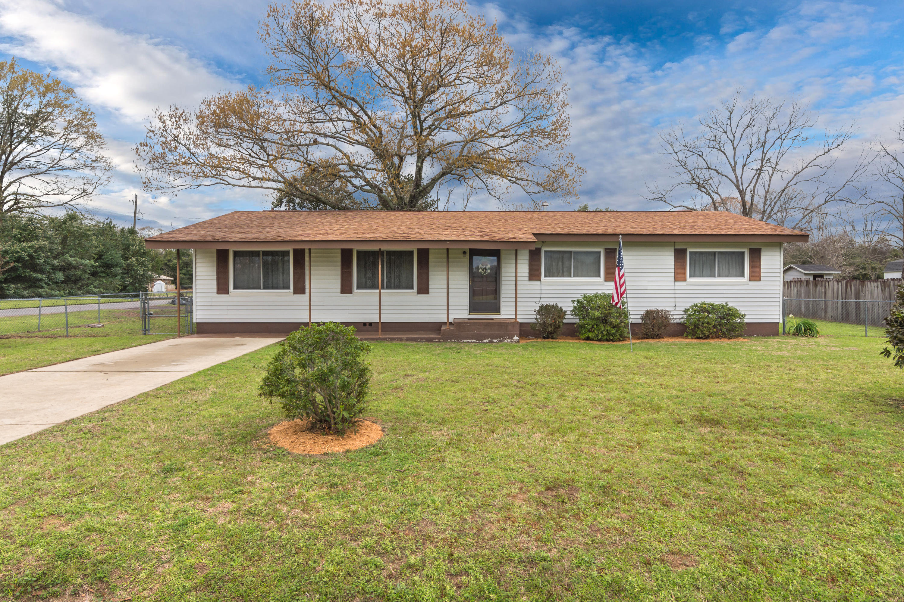 This quaint affordable home is a must see and a perfect fit for first time home buyers to empty nesters looking to downsize. Your new home features an awesome location just minutes from the developing North end of Crestview. You are also located within an hour drive to our gorgeous white sandy beaches, great shopping, and local military bases. This wonderful home features two separate living areas, and dining areas sure to meet your families needs around the holidays. Your large fenced in back yard will provide plenty of room for the kids to play and just be kids. To top things off your new home is well equipped with a home generator in case of any unexpected emergencies, a large detached carport/workshop area for weekend hobbies, and a lovely covered back deck to enjoy the fresh air.