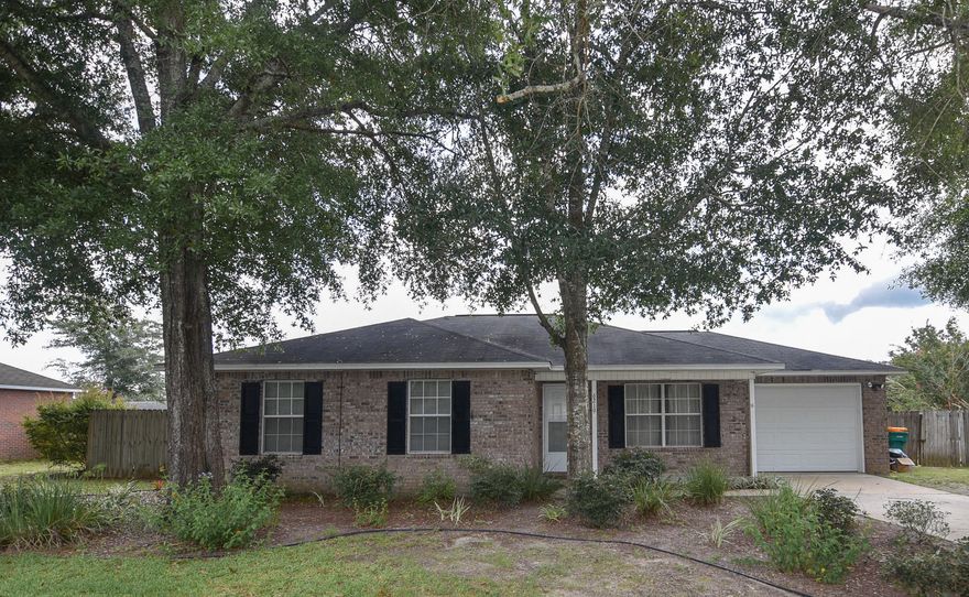 Great North Crestview property minutes away from downtown Crestview, with a quiet country feel. This cozy all brick 3bed 2bath home welcomes you with cathedral ceilings, open living area floor plan, covered patio and to top it off a HUGE back yard!