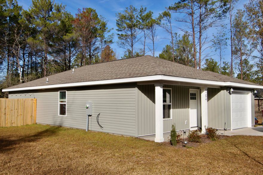 The home features LVP throughout. The kitchen is open to the living room and features an island, stainless steel appliances, white tile backsplash, granite counter tops and an under mount sink. The spacious master bedroom can hold a king size bed! The master bath has a walk in closet and the bathrooms also have granite counter tops! Fenced in backyard.