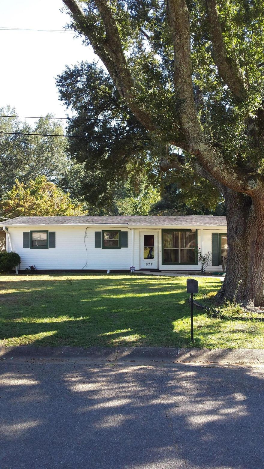 HOUSE HAS BEEN COMPLETELY REMODELED WITH TILE FLOORS THRU OUT, KITCHEN WITH NEW CABINETS, A LAZY SUSAN IN EACH CORNER,GRANITE COUNTER TOPS AND TILE BACK SPLASH. ALL APPLIANCES TO INCLUDE WASHER AND DRYER REMAIN. EQUIPPED WITH DIGITAL CONTROLLED THERMOSTAT,CEILING FANS THRU OUT, HOT WATER HEATER WITH TIMER, AND A STATE OF THE ART SECURITY SYSTEM. IT HAS A COVERED FRONT PORCH TO ENJOY A MAJESTIC OAK AND A COVERED BACK PATIO WITH A BEAUTIFUL DOGWOOD TREE. OUTSIDE BUILDING IS EQUIPPED WITH POWER AND 50 AMP OUTLET IN THE FRONT LEFT CORNER OF HOUSE TO ACCOMMODATE A RECREATIONAL VEHICLE. 2005 ROOF REPLACED, 2009 ELECTRIC AND PLUMBING UPDATED, 2013 2 1/2 TON CENTRAL HVAC SYSTEM INSTALLED . HOUSE IS A GEM OF A FIND EXTREMELY WELL MAINTAINED A MUST SEE