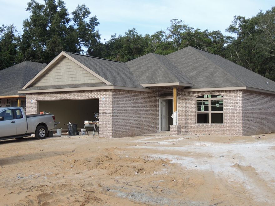 Centrally located in Shalimar, just moments from schools, shopping, beaches and work. This all brick home welcomes you. It is constructed by the award winning Watree Construction Company. The home is a split bedroom layout with 9 & 10 feet high ceilings throughout. Featuring an open floor plan with large tile in hallway, all bathrooms, dining and kitchen. The kitchen has designer cabinetry, granite counters and stainless appliances. The Master suite has a large walkin closet, the master bathroom has both a soaking tub and separate shower along with double sink vanity. Watree Homes offers the best value and construction in the area. Combine the location, the Builder and extended structure warranty and this is the best available.