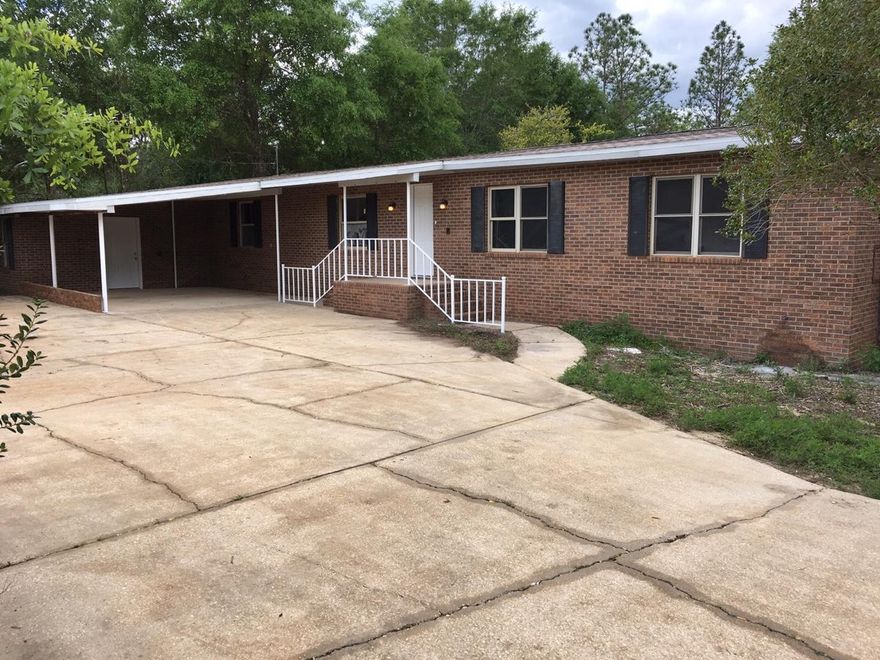 BEAUTIFUL 4 BEDROOM, 3 BATHROOM HOME ON 2 ACRES IN CRESTVIEW!! Conveniently located close to shopping and highway access!! This MOVE IN READY HOME has just been COMPLETELY RENOVATED with a NEW ROOF, NEW DECK, NEW PAINT, NEW FLOORING, NEW CABINETS, NEW GRANITE COUNTERTOPS, NEW STAINLESS STEEL APPLIANCES, and NEW FIXTURES!! Great layout, wood-burning fireplace, attached carport, and beautiful brand-new open deck area - perfect for entertaining! This is NOT a short sale or a bank owned property. This is a GREAT HOME that is PRICED TO SELL!! Come see it TODAY!! *Manufactured home with brick facade*