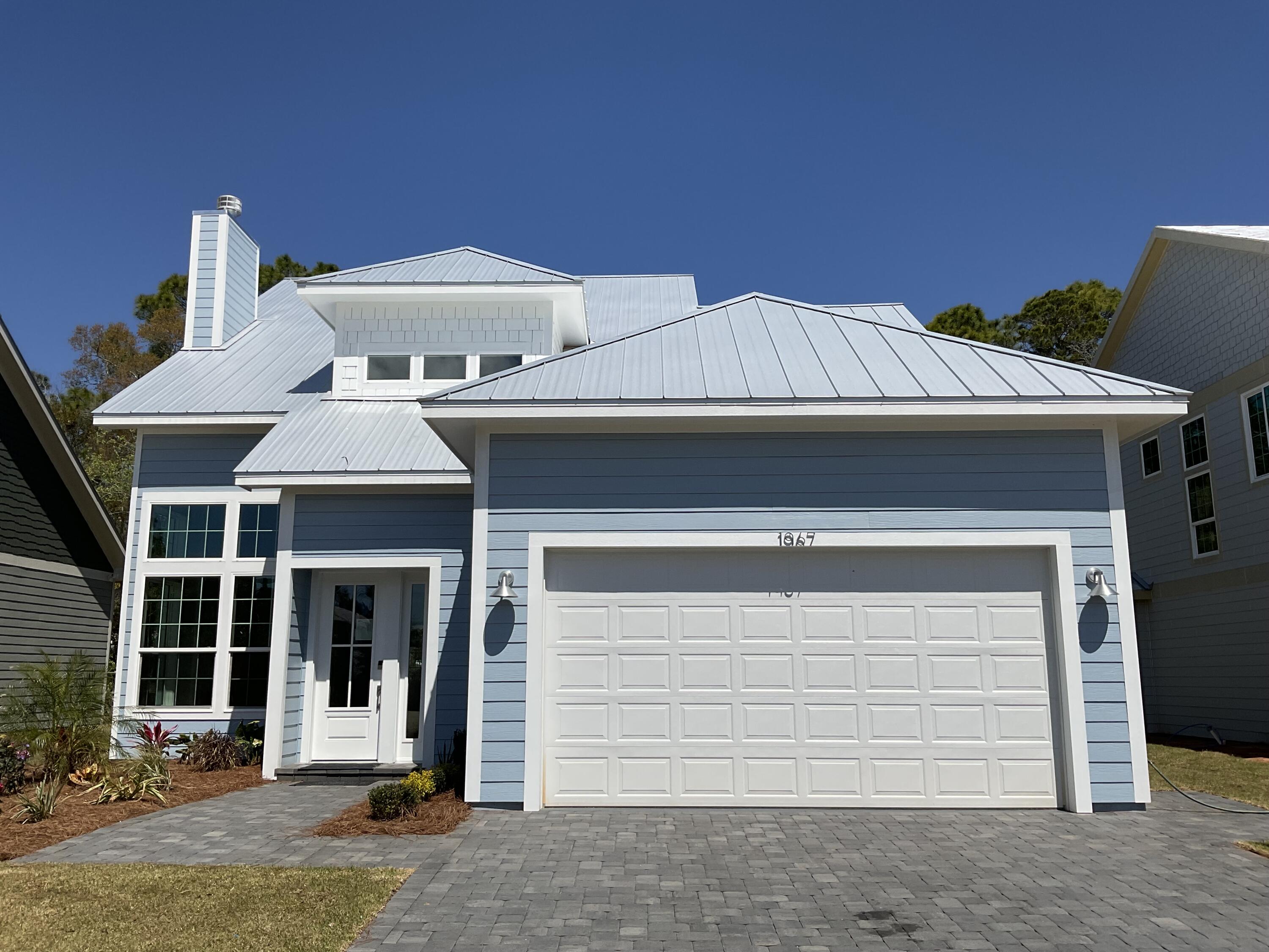 *Temp withdrawn for new photos* Introducing one of eleven upscale, dockside homes with direct canal access to Hogstown Bayou and the Choctawhatchee Bay! This newly completed craftsman-style residence offers 4 bedrooms, 2 1/2 baths, beautiful craftsmanship, tasteful accents, and your own private dock on the canal, already prepped with power and water. Ideally located, you can choose to enjoy this peaceful home with dock fishing, boating, or just relaxing - OR choose fun activities and white sandy beaches. Only minutes from the 30A Beaches or Sandestin's Grand Boulevard; shopping, restaurants, recreation, and entertainment are a short drive away. Immediately upon entering the home, you are welcomed by warm wood composite flooring throughout the main level. The soaring ceiling in the livi area adds to the openness of this gathering space, complete with a wood-burning fireplace and windows everywhere! This amazing kitchen has everything you need with plenty of room for cooking and entertaining. The quartz countertops, custom cabinets, and stainless appliances flow gracefully together in this inviting space. The peaceful views of the canal from the dining area and the access to the paver patio outside invite you to relax with a good book or good conversation with friends. There's a powder room just off the kitchen and continuing around the corner, you will find the primary bedroom suite. With a cathedral ceiling, two closets in the bedroom and stunning views, you will feel at home in here. The en-suite includes double vanities, a roomy walk-in closet, a separate rain shower, and a private room with beautiful tub and toilet. The warm wood composite flooring continues from the main level up the stairs, leading to three generous bedrooms branching off from the second level landing. This home will appeal to both full-time residents and those seeking a second home in this remarkable community.
