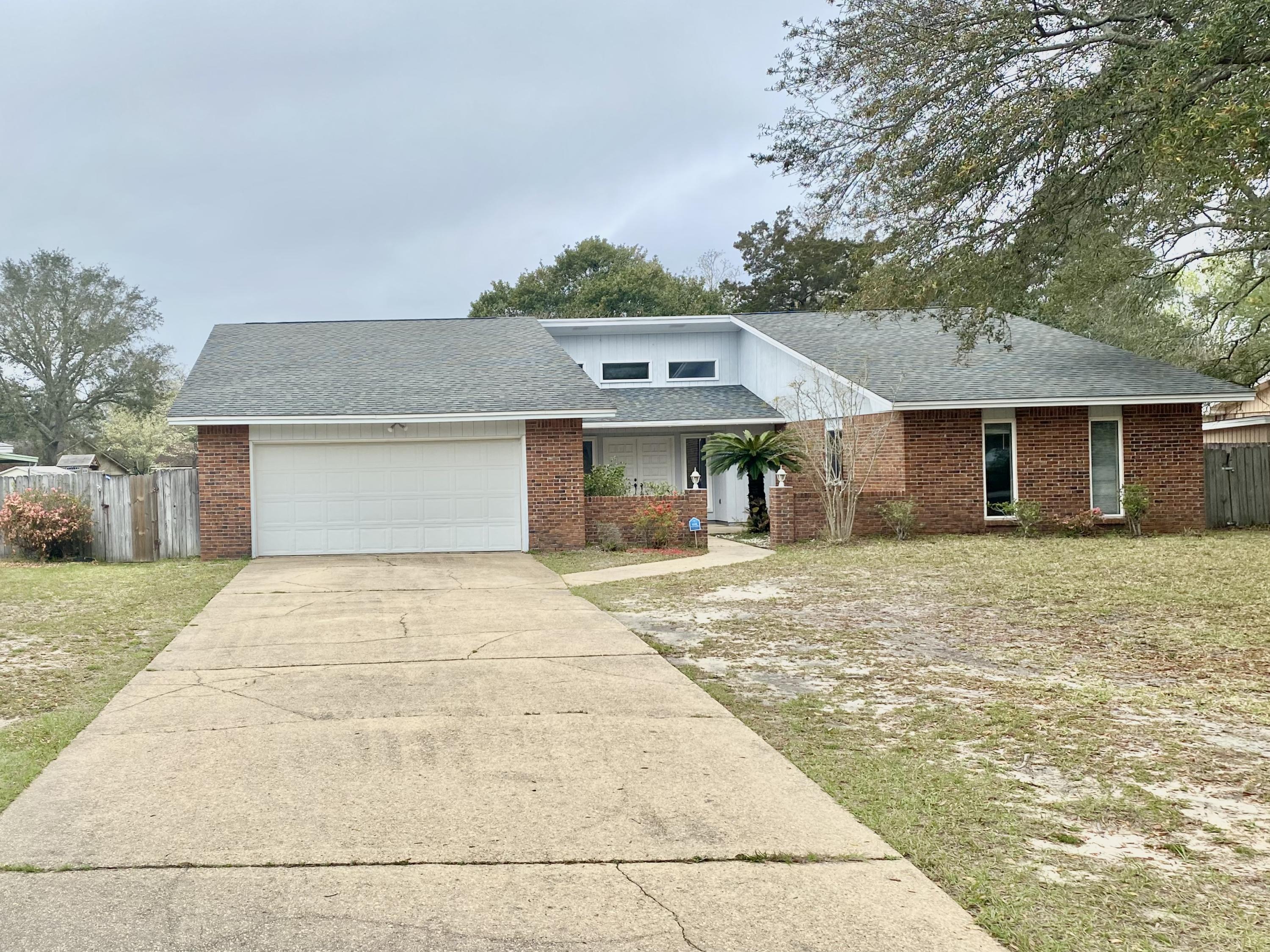 OPPORTUNITY in Bluewater Bay! New roof will be put on prior to closing. Large 2078 square feet 3 bedroom, 2 bath heart of Bluewater Bay home. This is your chance to make a home your own on a beautiful level, fenced lot. Large great room with vaulted ceiling, wood galore, extra patio room that is heated and cooled. It could be any type of room- play room, office, bedroom. Ample closets, interior laundry room, bonus landing area from the 2 car garage. This is a fabulous OPPORTUNITY to own in Bluewater Bay with the Marina, Tennis Club, Golf Course, Mulligan's: a short golf cart ride away. Home is zoned for Bluewater Elementary, Ruckel Middle OR Destin Middle School, Niceville High School and convenient to EOD school, Eglin AFB and Duke Field. Call today before it is gone. OPEN HOUSE Sunday