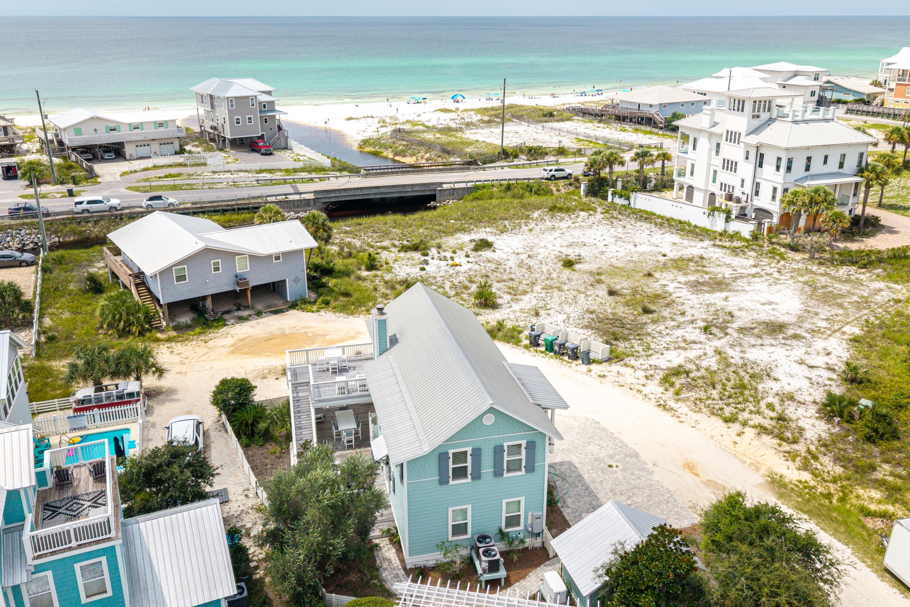 Coastal Home with Gulf Views & Oyster Lake OverlookEnjoy breathtaking Gulf of Mexico views from this beautifully updated 4-bedroom, 3-bath beach home on 30A's desirable west end. Perfectly located just across the street from the beach, this 2-story coastal retreat overlooks both the Gulf and Oyster Lake, offering the ideal blend of scenery, comfort, and convenience in Santa Rosa Beach.Step inside to a bright, open living space with a fireplace, abundant natural light, and panoramic Gulf views. The gourmet kitchen features custom cabinetry, quartz countertops, and professional-grade stainless steel appliances--including a Subzero refrigerator and Viking gas range--perfect for preparing fresh coastal cuisine.Extensive updates completed in 2021 include IPE Brazilian hardwood decking,