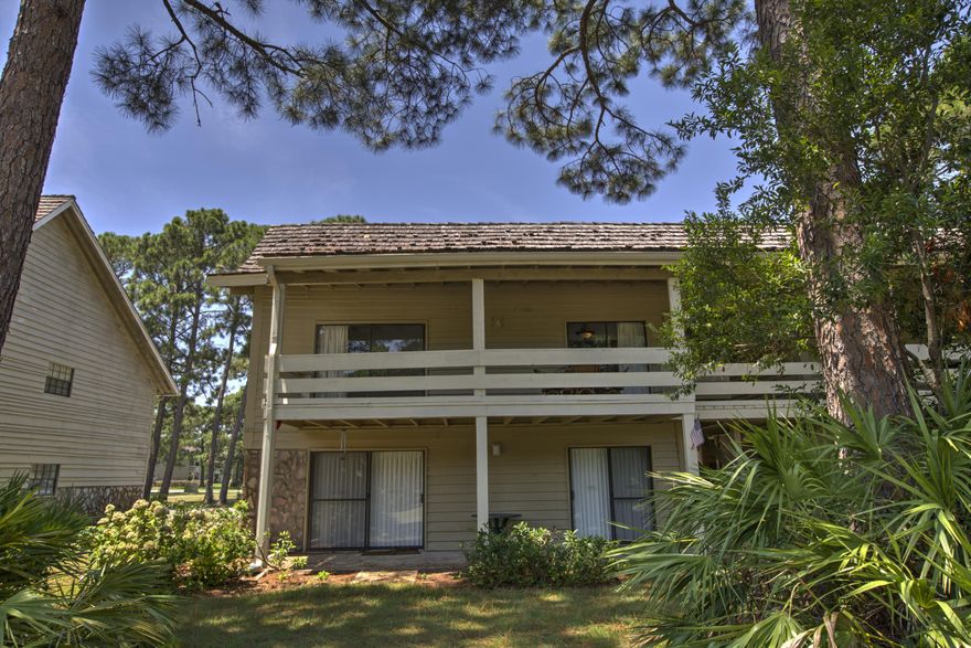 This is a must-see villa that is the lowest priced on the market by over 30,000! This unit has tons of potential if you're looking for a great primary residence, second home getaway, or an investment rental property. The top floor 1BR/1BA unit features numerous updates throughout including renovated granite countertops in the kitchen, tile floors throughout; excluding the bedroom, new a/c and hot water heater installed in 2013, freshly painted, and more. The open-concept living/dining room has a beautiful vaulted ceiling with wooden beams and leads you directly out to the large covered balcony overlooking the golf course. This villa is in a great location and is a short ride to the beautiful white sandy beaches. Seascape amenities feature gated access with security guards, over 2000.